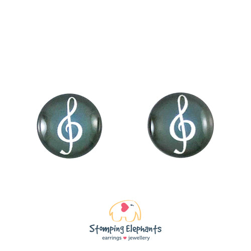 Stud Earrings - White treble clef with a black background.